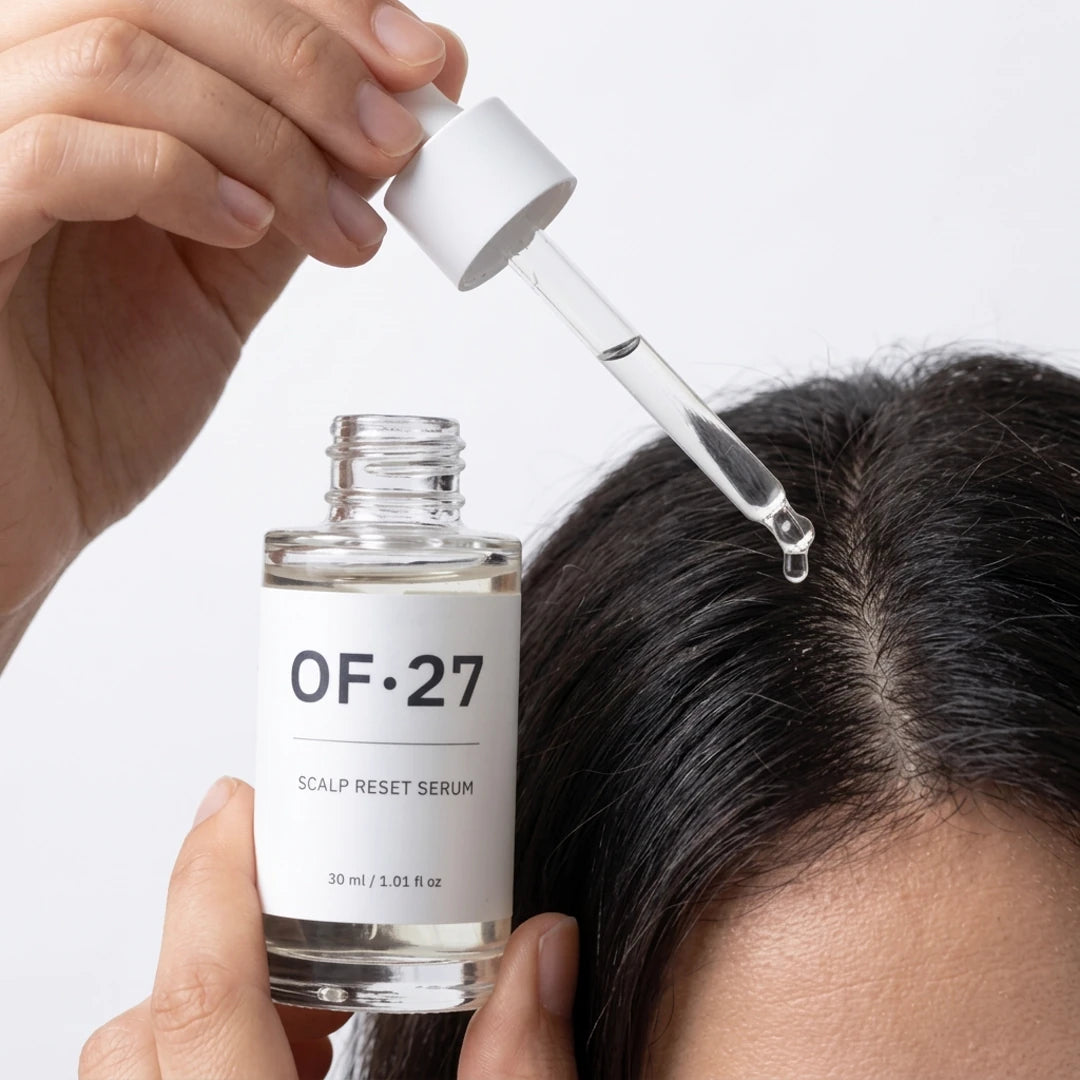Applying OF27 scalp reset serum